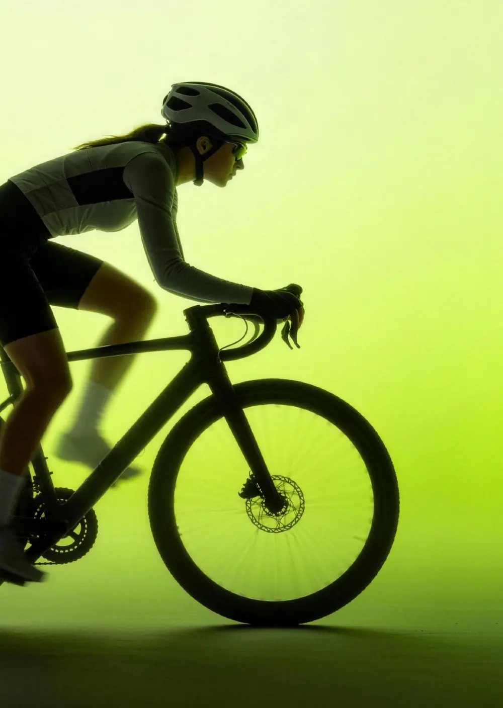 Cyclist silhouette on a lime background